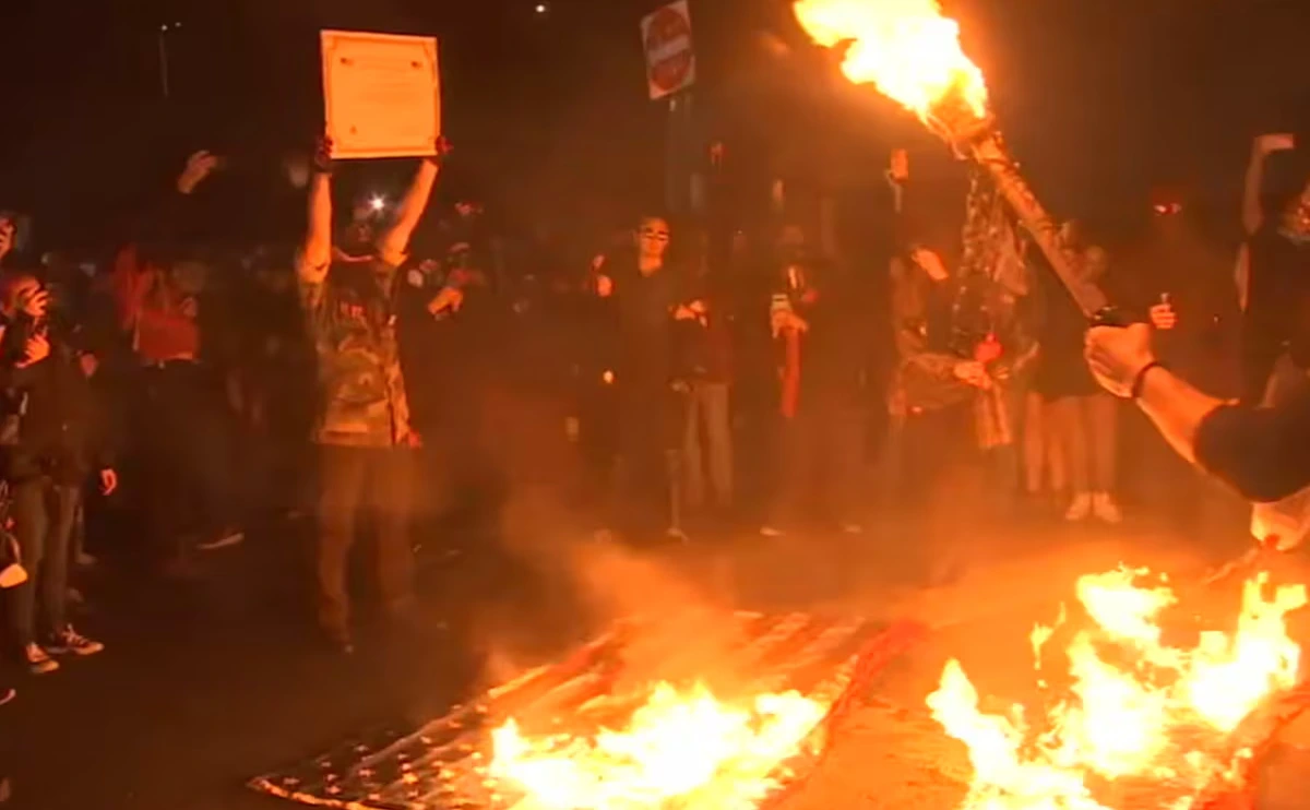 Protesters Break Through Gates At Portland ICE Facility And Burn Flags In Chaotic Scene