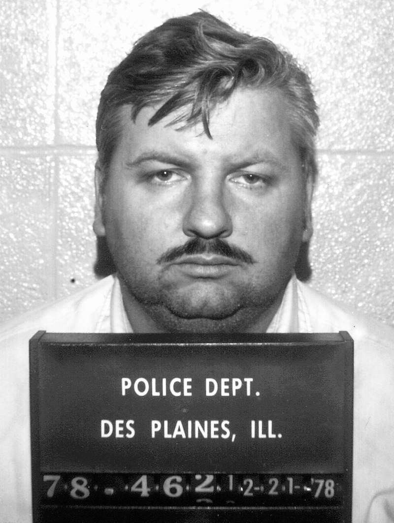 File photo of John Wayne Gacy’s arrest on December 21, 1978. After being convicted of 33 murders, he was executed by lethal injection in 1994. In 1998, investigators revisited a Chicago apartment building once linked to Gacy after new information suggested more possible victims buried nearby.