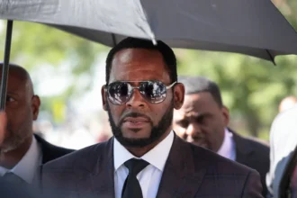 R. Kelly in court during legal proceedings, as a judge denies his emergency motion alleging a prison murder plot and requests for home detention
