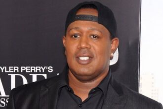 Master P and Make Good NOLA volunteers delivering colorful custom wheelchair to child in New Orleans